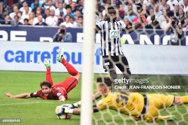 Paris Saint-Germain's Brazilian defender Maxwell reacts as Angers' French goalkeeper Alexandre Letellier catches the ball during the French Cup final...