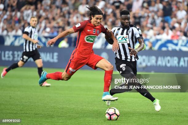 Paris Saint-Germain's Uruguayan forward Edinson Cavani vies for the ball with Angers' Ivorian defender Ismael Traore during the French Cup final...