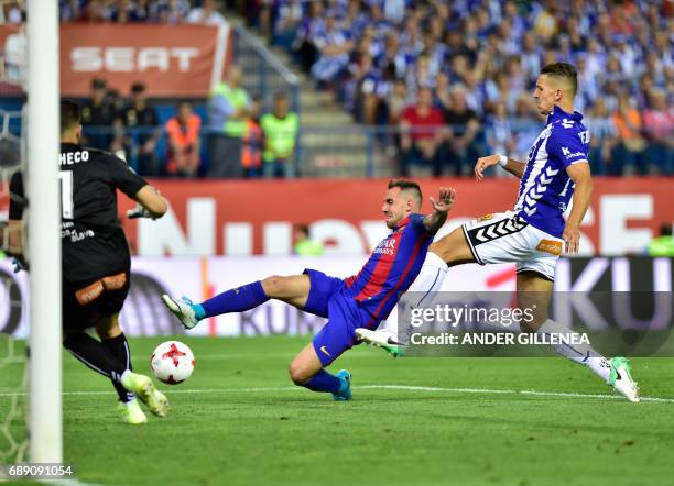 Barcelona's forward Munir El Haddadi vies with Deportivo Alaves' Moroccan defender Zouhair Feddal during the Spanish Copa del Rey final football...