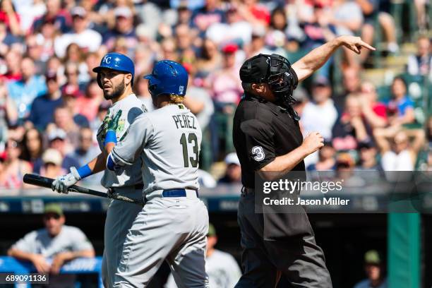 Home plate umpire Tim Welke ejects Eric Hosmer as Salvador Perez of the Kansas City Royals tries to hold him back after arguing a call during the...