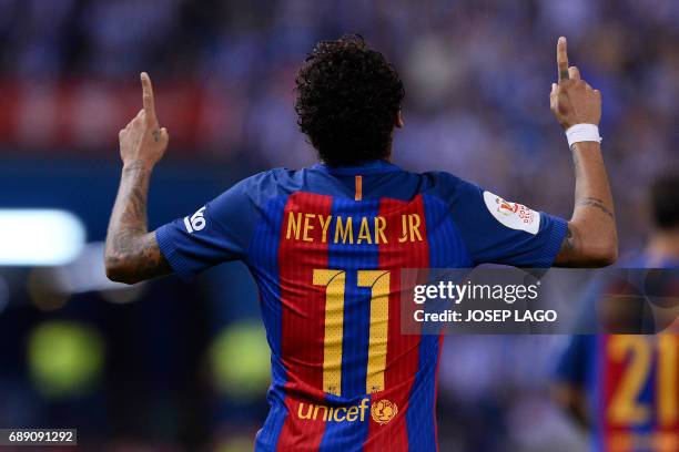 Barcelona's Brazilian forward Neymar celebrates after scoring during the Spanish Copa del Rey final football match FC Barcelona vs Deportivo Alaves...