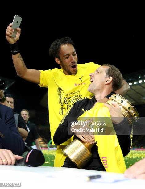 Thomas Tuchel and Pierre-Emerick Aubameyang of Dortmund joke after winning the DFB Cup final match between Eintracht Frankfurt and Borussia Dortmund...