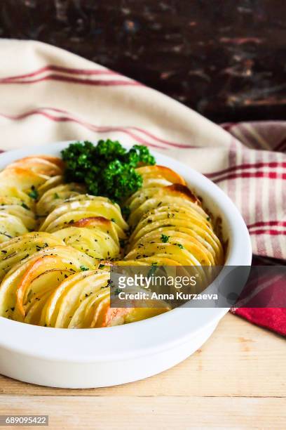 baked potatoes in a bowl, selective focus - jacket potato stock pictures, royalty-free photos & images