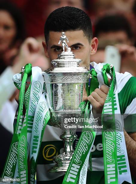 Tom Rogic of Celtic lifts the trophy during the William Hill Scottish Cup Final between Celtic and Aberdeen at Hampden Park on May 27, 2017 in...