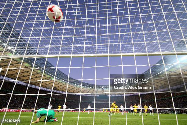 Pierre-Emerick Aubameyang of Dortmund scores his team's second goal from the penalty spot during the DFB Cup final match between Eintracht Frankfurt...