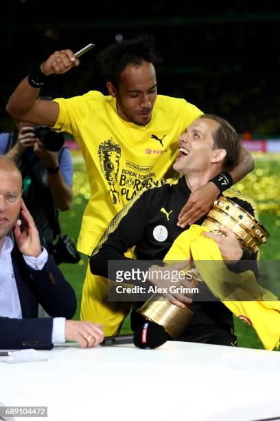 Thomas Tuchel and Pierre-Emerick Aubameyang of Dortmund joke after winning the DFB Cup final match between Eintracht Frankfurt and Borussia Dortmund...