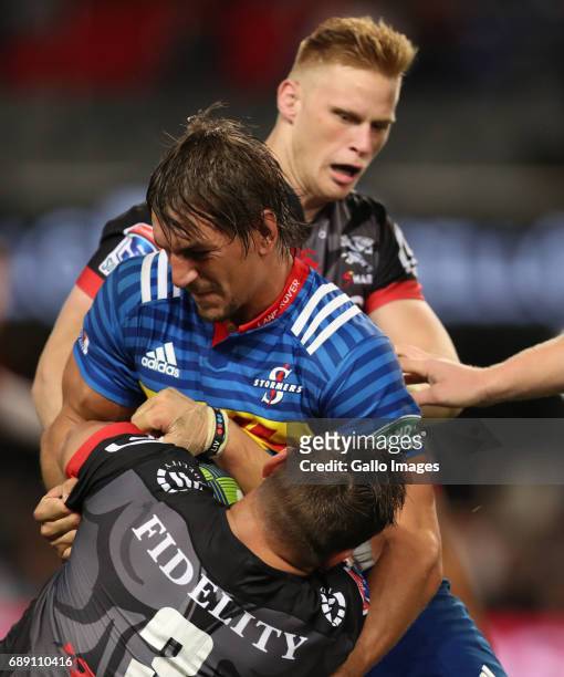 Eben Etzebeth of the DHL Stormers tackling Coenie Oosthuizen of the Cell C Sharks during the Super Rugby match between Cell C Sharks and DHL Stormers...