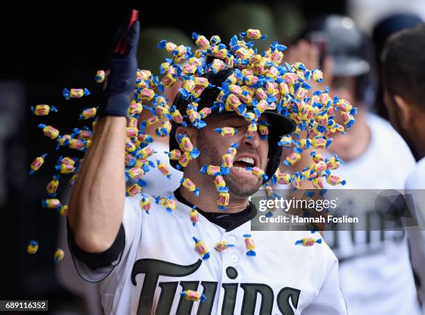 Brian Dozier of the Minnesota Twins celebrates hitting a two-run home run against the Tampa Bay Rays during the eighth inning of the game on May 27,...