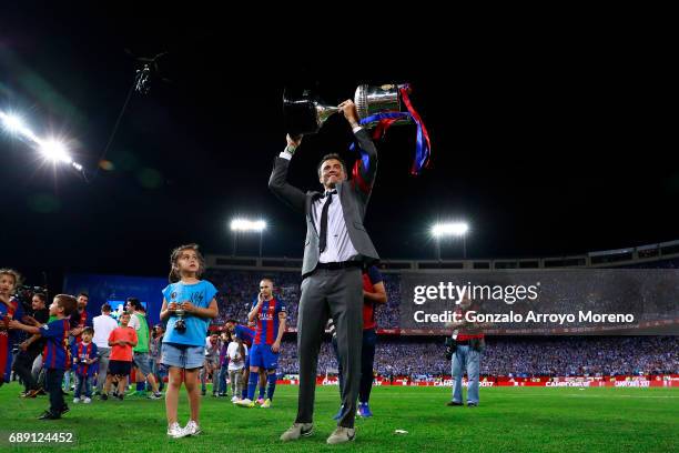 Head coach Luis Enrique Martinez of FC Barcelona team stands the King's Cup after winning the Copa Del Rey Final between FC Barcelona and Deportivo...