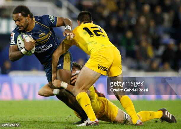 Henry Speight of Brumbies is tackled by Leonardo Senatore of Jaguares during a match between Jaguares and Brumbies as part of Super Rugby Rd 14 at...