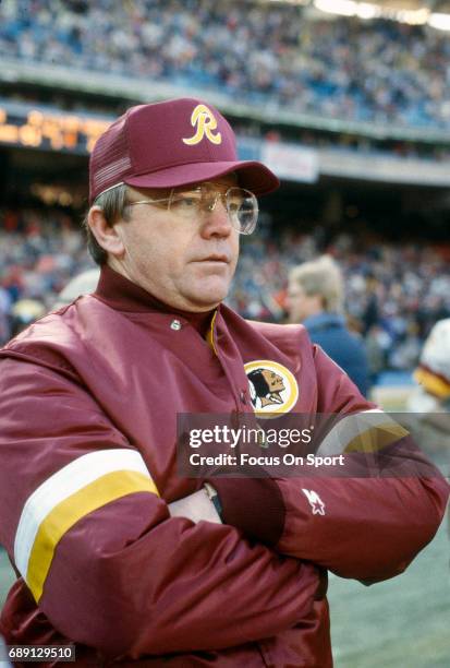 Head coach Joe Gibbs of the Washington Redskins looks on from the sidelines during an NFL football game circa 1984 at RFK Stadium in Washington,...