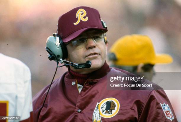 Head coach Joe Gibbs of the Washington Redskins looks on from the sidelines during an NFL football game circa 1984 at RFK Stadium in Washington,...