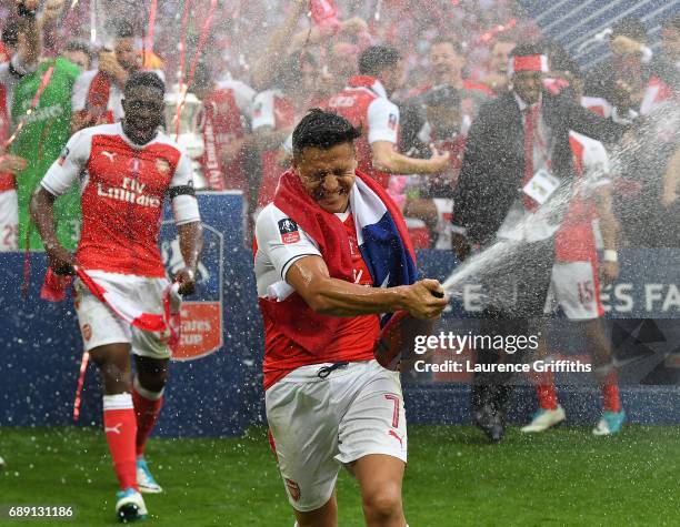 Alexis Sanchez of Arsenal celebrates victory after the Emirates FA Cup Final between Arsenal and Chelsea at Wembley Stadium on May 27, 2017 in...