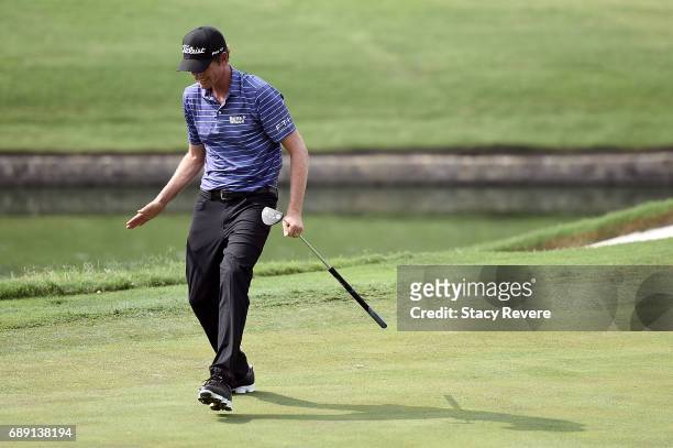 Webb Simpson reacts to a missed putt on the 18th green during Round Three of the DEAN & DELUCA Invitational at Colonial Country Club on May 27, 2017...