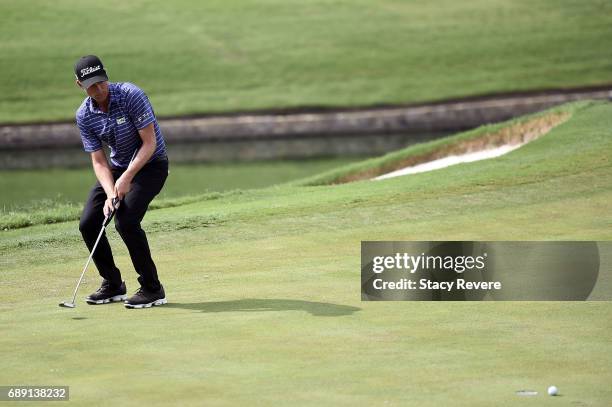 Webb Simpson reacts to a missed putt on the 18th green during Round Three of the DEAN & DELUCA Invitational at Colonial Country Club on May 27, 2017...