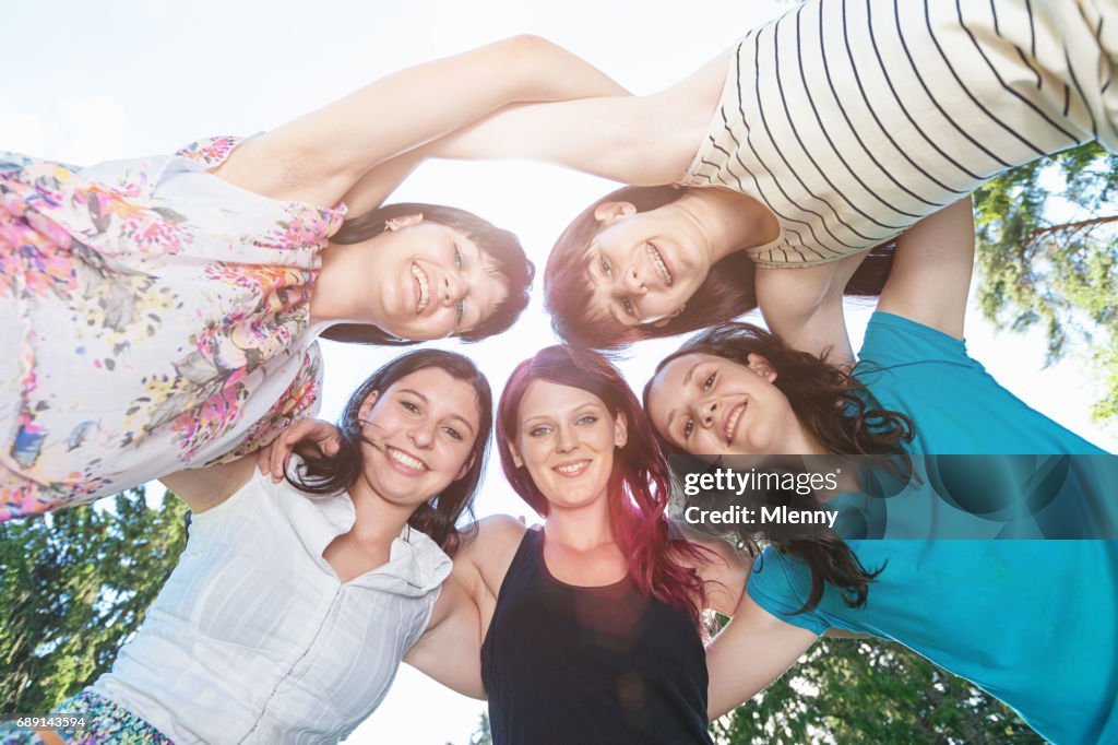 Arm in Arm Teenage Girls Together