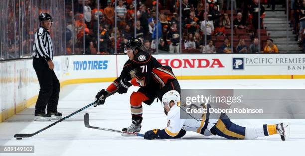 Brandon Montour of the Anaheim Ducks battles for the puck against Viktor Arvidsson of the Nashville Predators in Game Five of the Western Conference...