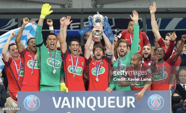 Maxwell of Paris Saint-Germain for his last game of is carreer lifts the cup with teammates after the French Cup Final match between Paris...