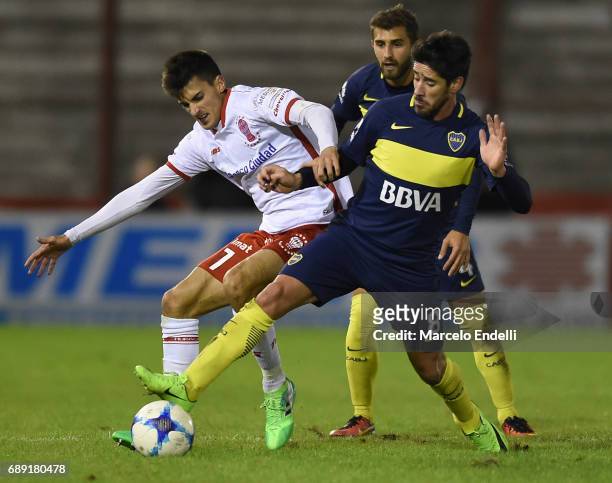 Ignacio Pussetto of Huracan fights for ball with Pablo Perez of Boca Juniors during a match between Huracan and Boca Juniors as part of Torneo...