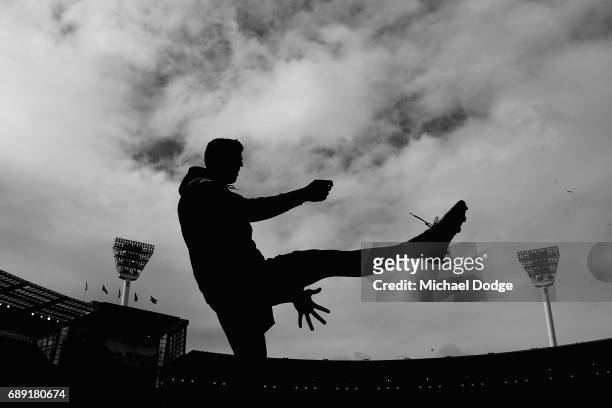 Scott Pendlebury of the Magpies kicks the ball before warm up during the round 10 AFL match between the Collingwood Magpies and Brisbane Lions at...