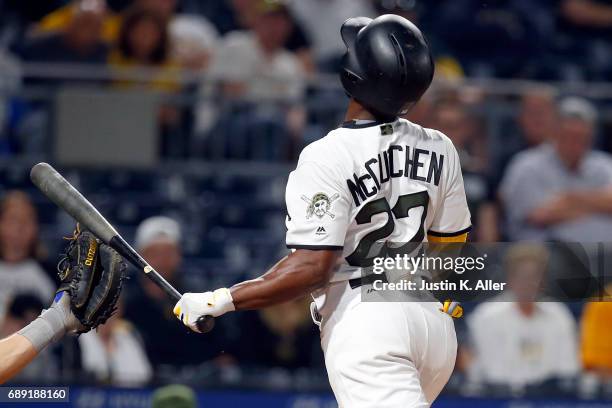 Andrew McCutchen of the Pittsburgh Pirates is hit by pitch in the tenth inning against the New York Mets at PNC Park on May 27, 2017 in Pittsburgh,...