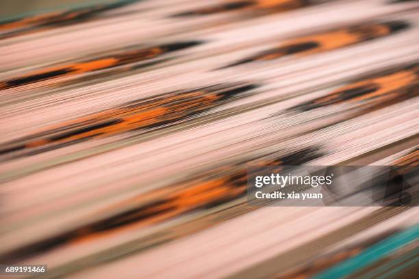 close up of the patterns on atlas silk being weaved,hotan,china - tribal head gear in china stock pictures, royalty-free photos & images