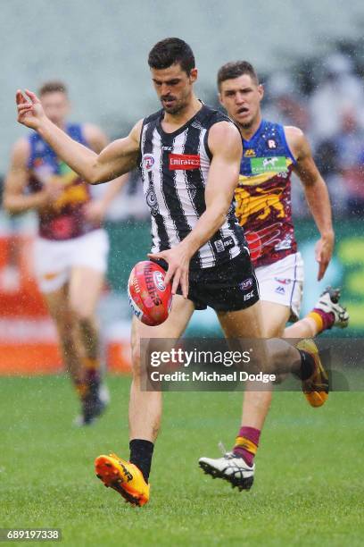 Scott Pendlebury of the Magpies kicks the ball during the round 10 AFL match between the Collingwood Magpies and Brisbane Lions at Melbourne Cricket...