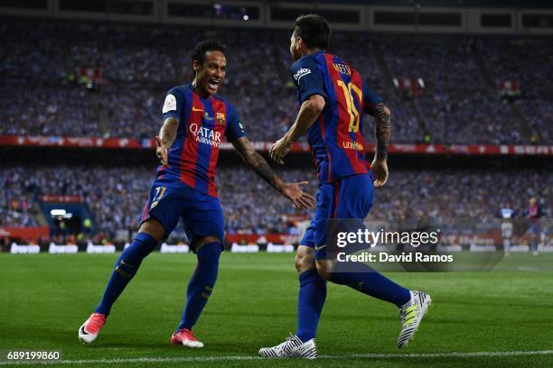 Lionel Messi of FC Barcelona celebrates with his team mate Neymar Jr. After scoring his team's first goal during the Copa Del Rey Final between FC...