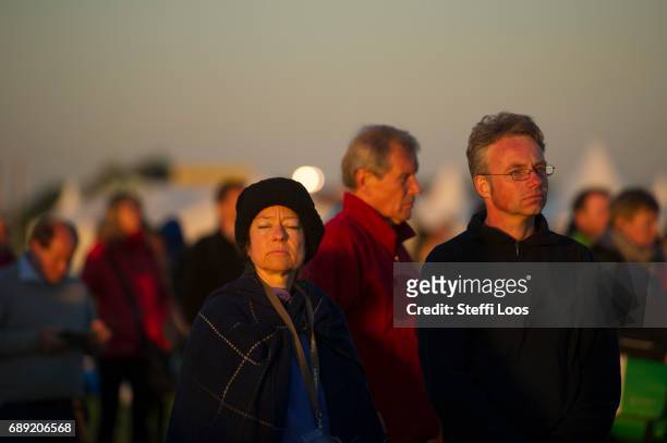 Pilgrims gather for sunrise prayers at dawn at the Elbe meadows on May 28, 2017 in Wittenberg, Germany. Up to 200,000 faithful are expected to attend...