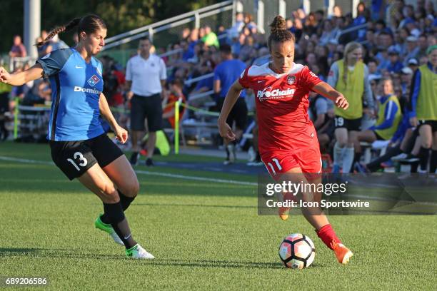 Washington Spirit forward Mallory Pugh drives past FC Kansas City defender Brittany Taylor in the first half of an NWSL women's soccer match between...