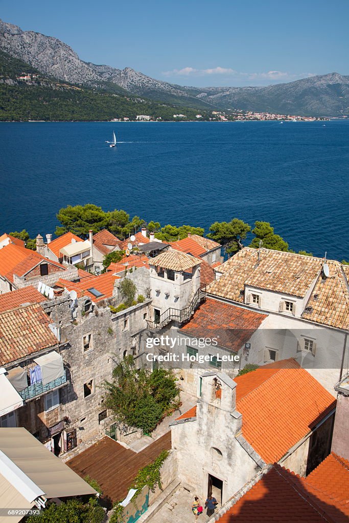 Overhead of Korcula rooftops and sailboat