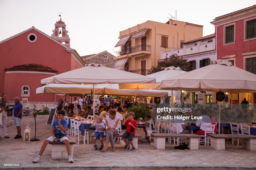 Outdoor restaurant seating in Old Town at sunset