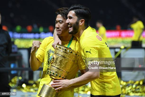 Shinji Kawaga of Borussia Dortmund celebrates with the trophy after the DFB Cup Final match between Eintracht Frankfurt and Borussia Dortmund at...