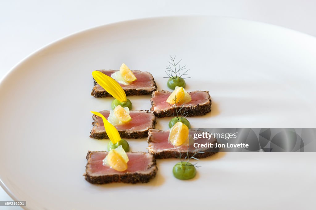 Seared Asian style Tuna on white plate