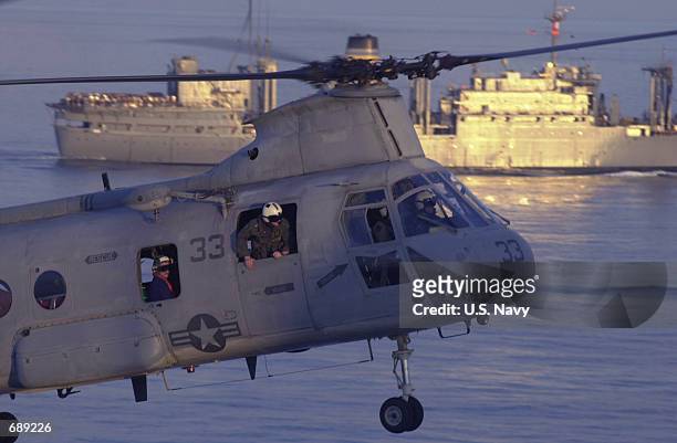 Helicopter approaches the flight deck of USS Peleliu December 26, 2001. The USS Peleliu is the flagship of an Amphibious Ready Group operating in...