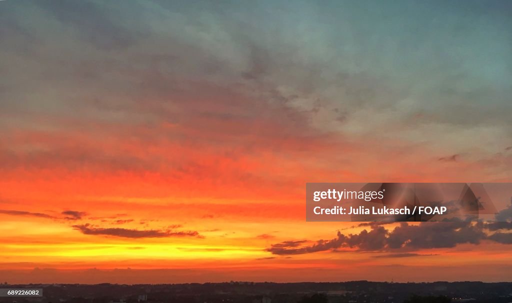 Scenic view of dramatic sky at dusk