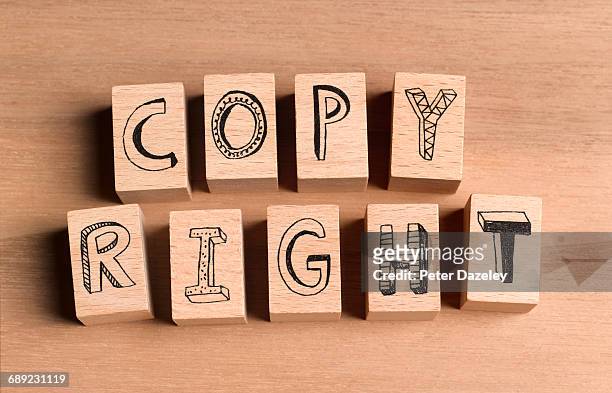 wooden bricks spelling the word copyright - trademark stock pictures, royalty-free photos & images