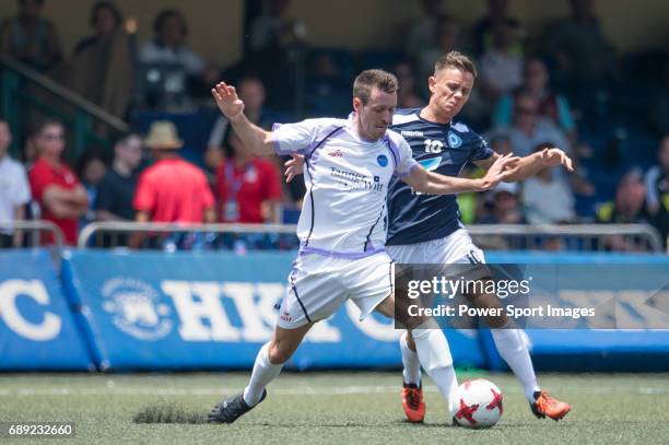 Discovery Bay's Daniel Lye competes with playonPROS Lee Hendrie for a ball during their Masters Tournament Plate Final match, part of the HKFC Citi...