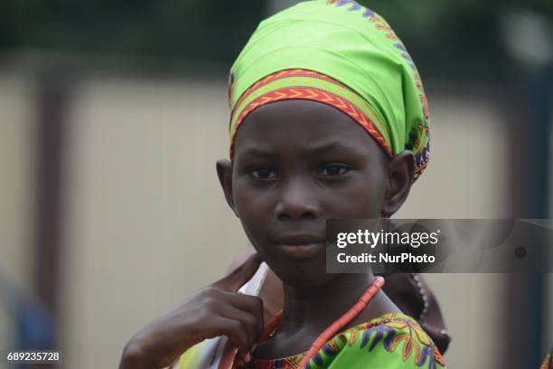 Pupil in native attire looks on during the Childrens Day parade at Agege Stadium in Lagos Nigeria May 27 2017.