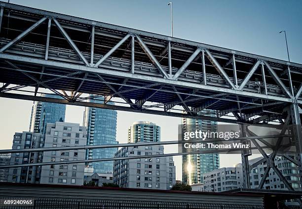 bay bridge and highrise buildings - san rafael california stock-fotos und bilder