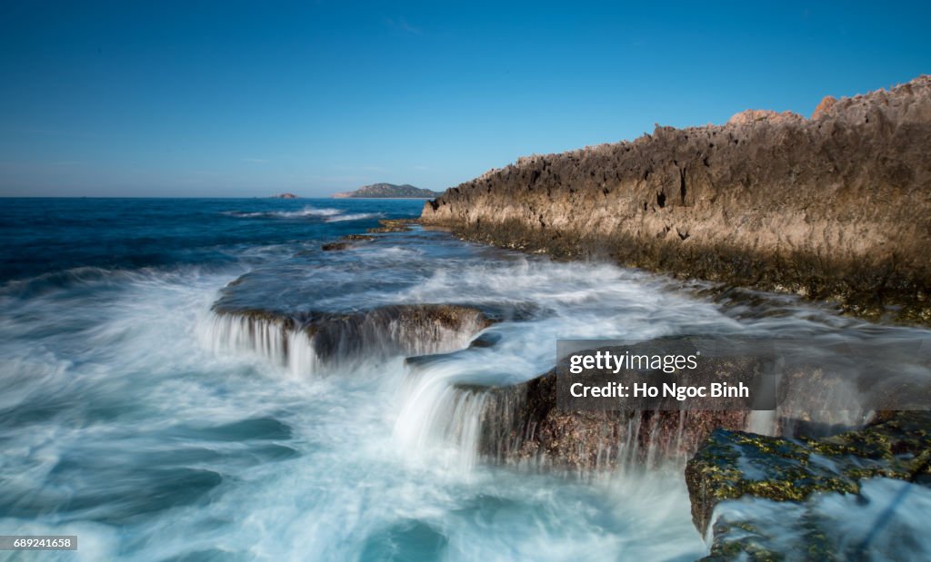 Waves Splashing On Rocks At Beach