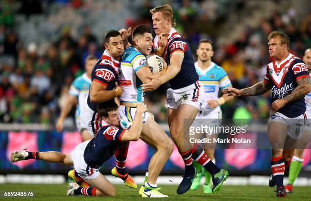 Nikola Cotric of the Raiders is tackled during the round 12 NRL match between the Canberra Raiders and the Sydney Roostrers at GIO Stadium on May 28,...