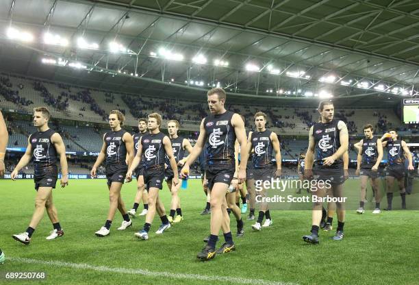 The Blues leave the field after losing the round 10 AFL match between the Carlton Blues and the North Melbourne Kangaroos at Etihad Stadium on May...