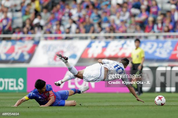 Dudu of Ventforet Kofu is tackled by Masato Morishige of FC Tokyo during the J.League J1 match between FC Tokyo and Ventforet Kofu at Ajinomoto...