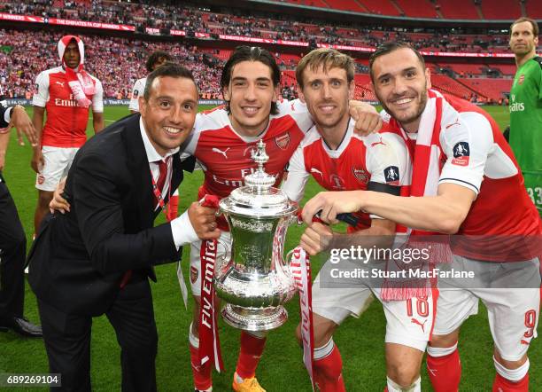 Santi Cazorla, Hecotr Bellerin, Nacho Monreal and Lucas Perez of Arsenal celebrate after the Emirates FA Cup Final between Arsenal and Chelsea at...