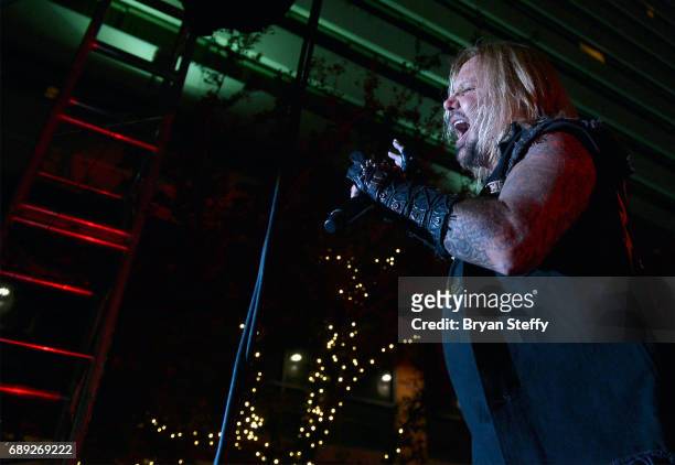 Singer Vince Neil performs during the "Rock the Street" Memorial Day weekend block party on Third Street at the Downtown Grand Hotel & Casino on May...