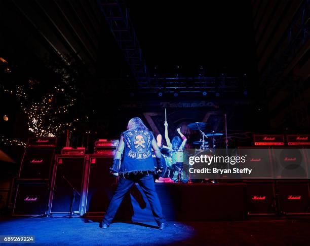 Singer Vince Neil performs with drummer Zoltan Chaney of Slaughter during the "Rock the Street" Memorial Day weekend block party on Third Street at...