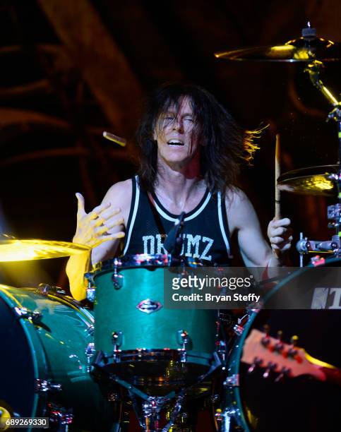 Drummer Zoltan Chaney of Slaughter performs with Vince Neil during the "Rock the Street" Memorial Day weekend block party on Third Street at the...