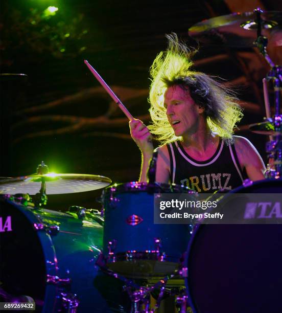 Drummer Zoltan Chaney of Slaughter performs with Vince Neil during the "Rock the Street" Memorial Day weekend block party on Third Street at the...