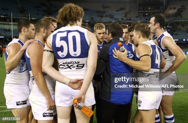 Brad Scott, Senior Coach of the Kangaroos addresses his players after the 2017 AFL round 10 match between the Carlton Blues and the North Melbourne...